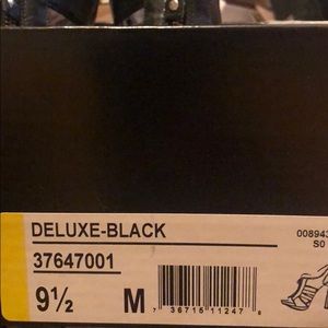 Carlos Santana black heels